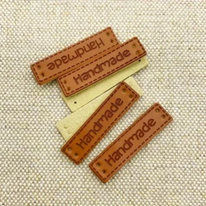 20 etichette finta pelle artigianali sciarpe cappelli toppe PU cucito maglieria