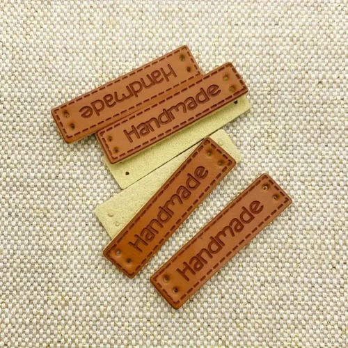 20 etichette finta pelle artigianali sciarpe cappelli toppe PU cucito maglieria